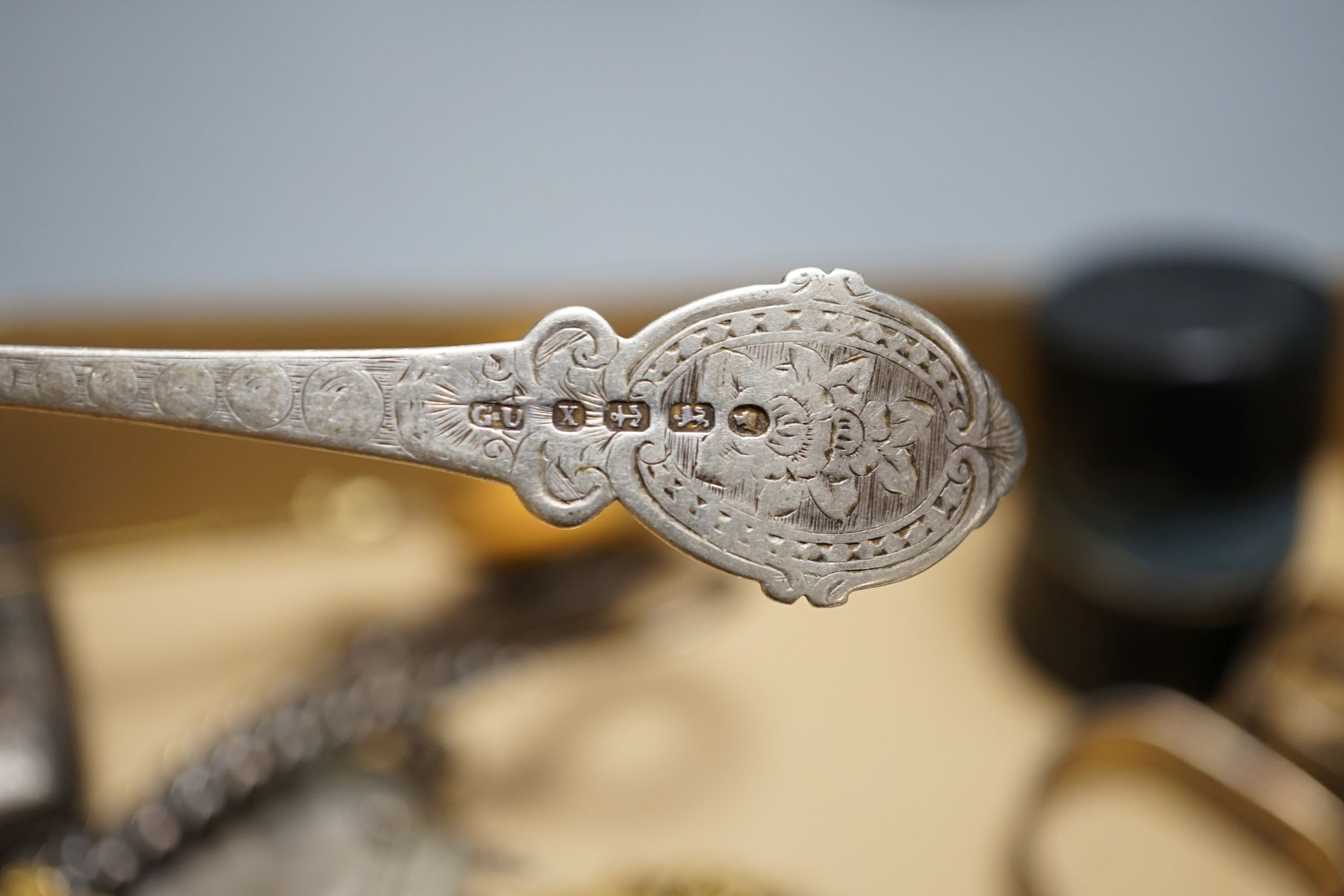 A cased Victorian silver part communion set, a silver cigarette case, two silver napkin rings, a set of five pierced silver bonbon dishes, a pair of Victorian silver grape shears, Georgian silver vinaigrette, pair of sil